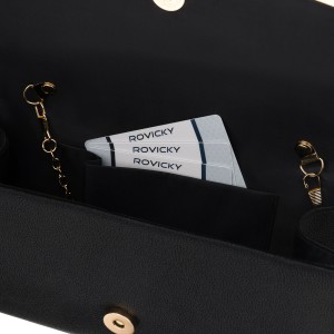 Czarna kopertówka damska wykonana ze skóry ekologicznej, zapinana klipsem magnetycznym - Rovicky