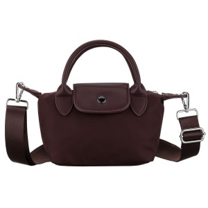 Bordowa listonoszka damska z poliestru zawieszona na szerokim pasku i poręcznych uchwytach - Peterson