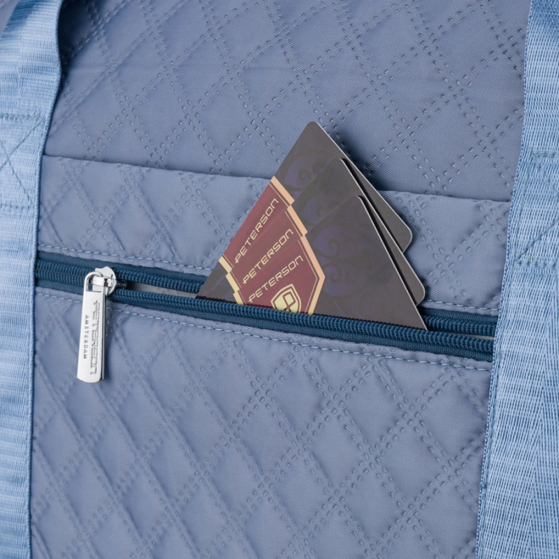 Treningowa torba wykonana z poliestru w niebieskim kolorze, wyposażona w uchwyt na walizkę - Peterson